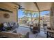 Spacious covered patio features stylish seating, ceiling fan and a desert landscape view at 7373 E Us Highway 60 -- # 108, Gold Canyon, AZ 85118