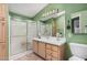 Bathroom featuring a frosted glass enclosed shower, tile floor and updated fixtures at 8500 E Southern Ave # 379, Mesa, AZ 85209