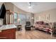 Relaxing bedroom with soft light, day bed, recliner, and laminate flooring at 8500 E Southern Ave # 379, Mesa, AZ 85209