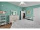 Comfortable bedroom featuring teal walls and white furniture at 8500 E Southern Ave # 379, Mesa, AZ 85209
