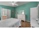 Comfortable bedroom features teal walls, white furniture, and ensuite bathroom at 8500 E Southern Ave # 379, Mesa, AZ 85209