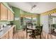 Bright breakfast nook featuring a ceiling fan, wooden table and many windows at 8500 E Southern Ave # 379, Mesa, AZ 85209