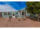 Exterior view of the home featuring low-maintenance landscaping and mature trees providing shade at 8500 E Southern Ave # 379, Mesa, AZ 85209