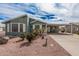 Charming single-story home with an attached carport and colorful desert landscaping at 8500 E Southern Ave # 379, Mesa, AZ 85209