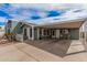Charming single-story home with an attached carport and desert landscaping at 8500 E Southern Ave # 379, Mesa, AZ 85209