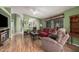 Inviting living room featuring hardwood floors, comfortable seating and bright green walls at 8500 E Southern Ave # 379, Mesa, AZ 85209