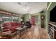 Inviting living room featuring hardwood floors, comfortable seating and bright green walls at 8500 E Southern Ave # 379, Mesa, AZ 85209