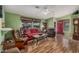 Inviting living room featuring hardwood floors, comfortable seating and bright green walls at 8500 E Southern Ave # 379, Mesa, AZ 85209