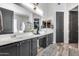 Bathroom with a large mirror, double sink vanity, and stylish gray cabinets providing ample storage space at 854 S Del Rio Ct, Apache Junction, AZ 85120