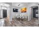 Dining room with sleek white table set with a view to entry and hallway at 854 S Del Rio Ct, Apache Junction, AZ 85120