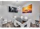 Dining room with modern glass table, white chairs, and pendant lighting at 854 S Del Rio Ct, Apache Junction, AZ 85120