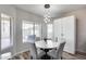 Cozy dining area features a round table, stylish chairs, and a bright window with natural light at 854 S Del Rio Ct, Apache Junction, AZ 85120