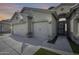 Attached three-car garage and secure front door of this home, perfect for easy access and additional storage at 854 S Del Rio Ct, Apache Junction, AZ 85120