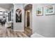 Hallway with unique decor, wood flooring, and multiple entryways to other rooms at 854 S Del Rio Ct, Apache Junction, AZ 85120