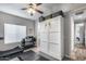 A home gym boasts a treadmill and weight rack, alongside a concealed Murphy bed for versatile space usage at 854 S Del Rio Ct, Apache Junction, AZ 85120