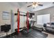 Spacious home gym featuring weight rack, treadmill, and rubber flooring for exercise and fitness at 854 S Del Rio Ct, Apache Junction, AZ 85120