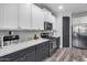 Close up of kitchen featuring stainless steel appliances and white cabinets with modern hardware at 854 S Del Rio Ct, Apache Junction, AZ 85120