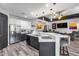 Open kitchen with island and seating flows into a living area, creating an inviting space at 854 S Del Rio Ct, Apache Junction, AZ 85120