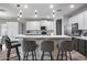 Modern kitchen with stainless appliances, a breakfast bar, and stylish pendant lighting at 854 S Del Rio Ct, Apache Junction, AZ 85120