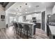 Modern kitchen featuring sleek white cabinets, stainless steel appliances, an eat-in island and pendant lighting at 854 S Del Rio Ct, Apache Junction, AZ 85120