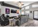 Comfortable living room with reclining chairs, fan, and large windows at 854 S Del Rio Ct, Apache Junction, AZ 85120