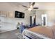 Serene main bedroom with a large bed, TV, and seating area, offering a luxurious and comfortable space at 854 S Del Rio Ct, Apache Junction, AZ 85120