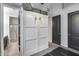 Murphy bed with gray storage bags and dark doors in a room with light gray walls and neutral floors at 854 S Del Rio Ct, Apache Junction, AZ 85120