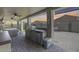 Covered outdoor grill area features modern appliances, perfect for barbecuing and outdoor entertaining at 854 S Del Rio Ct, Apache Junction, AZ 85120