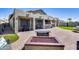 An outdoor kitchen and covered patio create an ideal space for entertaining and enjoying the backyard at 854 S Del Rio Ct, Apache Junction, AZ 85120
