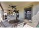Outdoor patio featuring a hot tub, lounge area, ceiling fans, and outdoor TV's at 854 S Del Rio Ct, Apache Junction, AZ 85120