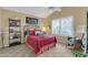 Bedroom with bed, vaulted ceiling, plantation shutters, and seating area at 8935 E Larkspur Dr, Scottsdale, AZ 85260