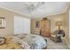 Bedroom with closet, wooden cabinet and ceiling fan at 8935 E Larkspur Dr, Scottsdale, AZ 85260