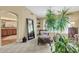 Bedroom featuring seating area with plants, large mirror, and neutral colored carpet at 8935 E Larkspur Dr, Scottsdale, AZ 85260