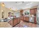 Gourmet kitchen with stainless steel appliances and granite countertops at 8935 E Larkspur Dr, Scottsdale, AZ 85260
