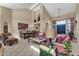 Open-concept living room with high ceilings, a dining area, and a comfortable seating area at 8935 E Larkspur Dr, Scottsdale, AZ 85260