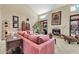Bright living room features vaulted ceilings, a fireplace, and access to the backyard through sliding glass doors at 8935 E Larkspur Dr, Scottsdale, AZ 85260