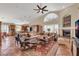 Spacious living room with fireplace, vaulted ceilings, and exposed beams at 8935 E Larkspur Dr, Scottsdale, AZ 85260