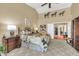 Vaulted ceiling main bedroom with decorative horse art at 8935 E Larkspur Dr, Scottsdale, AZ 85260