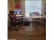 Modern home office with sleek desk and comfortable chair, featuring contemporary artwork and natural light at 8935 E Larkspur Dr, Scottsdale, AZ 85260