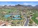 Aerial view of the community tennis courts, golf course, and surrounding mountain views at 9270 E Thompson Peak Pkwy # 381, Scottsdale, AZ 85255