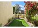 Enclosed backyard featuring artificial turf and a water feature at 9270 E Thompson Peak Pkwy # 381, Scottsdale, AZ 85255