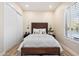 Bedroom with white duvet, paneled headboard and plantation shutters at 9270 E Thompson Peak Pkwy # 381, Scottsdale, AZ 85255