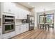 Bright kitchen featuring stainless steel appliances, sleek white cabinets, and lots of counter space at 9270 E Thompson Peak Pkwy # 381, Scottsdale, AZ 85255