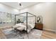 Bright main bedroom featuring a canopy bed, modern decor, and lots of natural light at 9270 E Thompson Peak Pkwy # 381, Scottsdale, AZ 85255