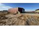 A view of the red metal building, located on the property at 9600 S 393Rd Ave, Tonopah, AZ 85354