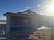 Exterior shot of the block home showing an open patio area with post supports at 9600 S 393Rd Ave, Tonopah, AZ 85354