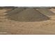 A close exterior shot of the piles of gravel on the property that can be used in construction or for landscaping at 9600 S 393Rd Ave, Tonopah, AZ 85354