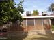 Exterior shot of lattice enclosed patio and the AC units above the roof at 10327 W Prairie Hills Cir, Sun City, AZ 85351
