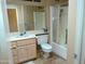 Practical bathroom featuring a vanity, toilet, and shower with glass door at 10327 W Prairie Hills Cir, Sun City, AZ 85351