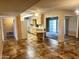 Open floor plan featuring ceramic tile, a breakfast nook, and updated cabinets with plenty of natural light at 10327 W Prairie Hills Cir, Sun City, AZ 85351